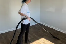 Thumbnail for MaidPro Charleston house cleaner vaccuming a hardwood floor in North Carolina