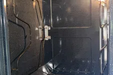 Thumbnail for Clean empty kitchen oven interior with heating elements and light on inside