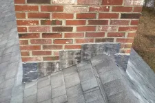 Thumbnail for a brick wall with a brick walkway