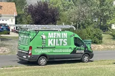 Thumbnail for a green van with a sign on it