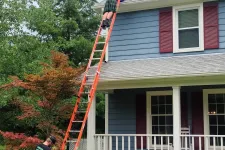 Thumbnail for a person on a ladder on a house