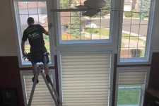 Thumbnail for a person standing on a ladder