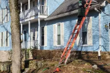 Thumbnail for a person on a ladder on a house