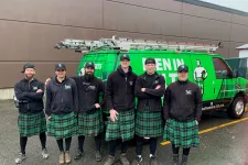 Thumbnail for a group of men in kilts standing in front of a green truck