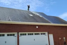 Thumbnail for a person standing on a roof