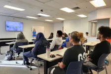 Thumbnail for a group of people sitting at desks in a room