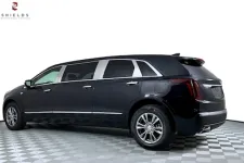 Thumbnail for Sleek black luxury SUV limousine side view against a white backdrop.