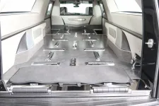 Thumbnail for Interior view of a hearse with a spacious compartment designed for transporting caskets.
