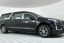 Thumbnail for Black luxury Cadillac limousine featuring sleek lines and modern design.