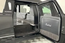 Thumbnail for Luxurious black limousine interior highlighting spaciousness and elegant design features.