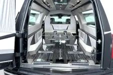 Thumbnail for Interior view of a luxury hearse showcasing stylish seating and premium finishes.