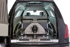 Thumbnail for Interior view of a luxury hearse showcasing its elegant design and space for urn placement.