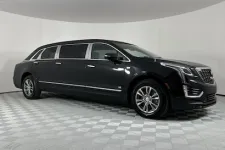 Thumbnail for Luxury black limousine with sleek design parked on a textured floor, showcasing elegance and style.