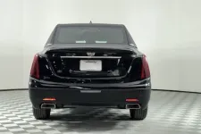 Thumbnail for Rear view of a black Cadillac sedan with sleek design and modern taillights.