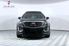 Thumbnail for Front view of a black Cadillac XT5 showcasing its sleek design and distinctive grille.