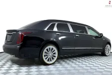 Thumbnail for Black luxury limousine showcasing sleek design and stylish wheels.