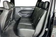 Thumbnail for Interior view of a spacious black leather car backseat with three passenger seats.