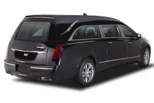 Thumbnail for A sleek black Cadillac hearse showcasing elegant design and modern features from a side view.