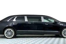 Thumbnail for Black luxury limousine with chrome accents, parked on a checkered floor background.