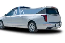 Thumbnail for Rear view of a sleek silver pickup truck with a custom bed cover and stylish wheels.