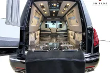 Thumbnail for Spacious interior of a luxury hearse showcasing sleek design and elegant finishes.
