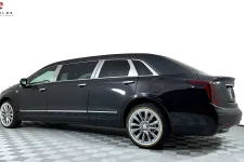 Thumbnail for Sleek black luxury limousine showcasing polished wheels and elegant design.