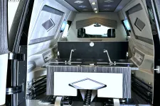 Thumbnail for Luxurious vehicle interior featuring dual sinks and elegant finishes for comfort and style.