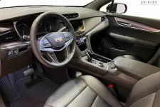 Thumbnail for Luxurious Cadillac car interior featuring leather seats and modern dashboard design.