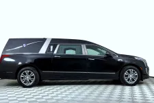 Thumbnail for Black luxury hearse with silver accents and tinted windows on checkered showroom floor in a white studio.