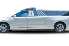 Thumbnail for A sleek white pickup truck with a unique design and modern features, showcased from the side.