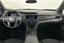 Thumbnail for Modern Cadillac car interior featuring sleek dashboard and advanced technology display.