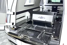 Thumbnail for Luxury hearse interior featuring sleek chrome accents and refined wooden details.