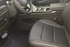 Thumbnail for Luxury car interior with black leather seats, digital dashboard, and modern steering wheel controls.