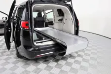 Thumbnail for Interior view of a spacious minivan with adjustable cargo area and flat loading ramp.