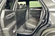 Thumbnail for Interior view of a luxury SUV showing spacious black leather seating in the back.