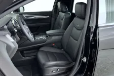 Thumbnail for Interior view of a modern black car showing leather front seats and dashboard with steering wheel.