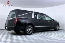 Thumbnail for Black hearse with sleek design, showcased in a professional studio setting.