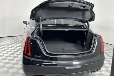 Thumbnail for Luxury sedan with an open trunk, showcasing spacious cargo area and sleek design.