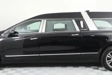Thumbnail for Side view of a black Cadillac hearse showcasing elegant design and sleek lines.