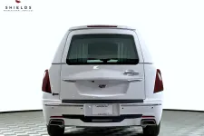 Thumbnail for Back view of a Cadillac luxury vehicle featuring a sleek white exterior and modern design.