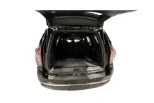 Thumbnail for Interior view of a spacious black SUV trunk with a flat loading surface.