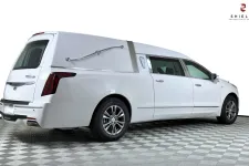 Thumbnail for White Cadillac hearse showcasing sleek design and professional detailing.
