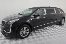 Thumbnail for Sleek black Cadillac XT5 limousine showcasing modern design and luxury features.
