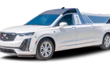 Thumbnail for White Cadillac XT6 SUV with a custom truck bed design, showcasing sleek lines and modern features.