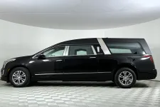 Thumbnail for Sleek black hearse vehicle with tinted windows on a checkered floor in a white studio space