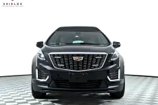 Thumbnail for Front view of a sleek black Cadillac vehicle showcasing modern design features.