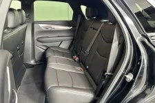 Thumbnail for Interior view of a spacious black leather rear seat in an SUV, showcasing comfort and modern design.