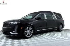 Thumbnail for Luxury black Cadillac funeral hearse with sleek design and chrome accents on a checkered floor.