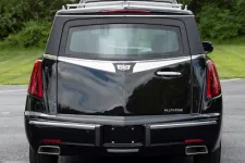 Thumbnail for Rear view of a black Cadillac Platinum with sleek lines and luxury design features.