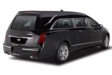 Thumbnail for Luxurious black Cadillac hearse with sleek design and elegant details, ideal for transportation services.